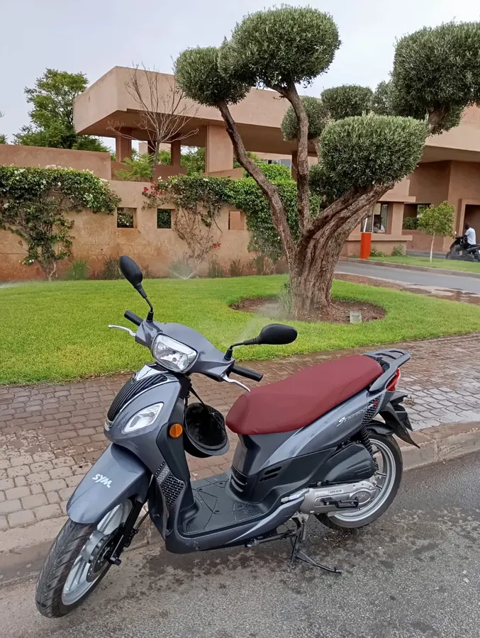 Moto2Kech scooter outside a Marrakech property
